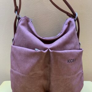 Bolso y mochila multibolsillos en piel sintética mate de Kcb. Frontal rosa