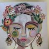 Pintura sobre lienzo cara de mujer con pendientes. Con ojos cerrados