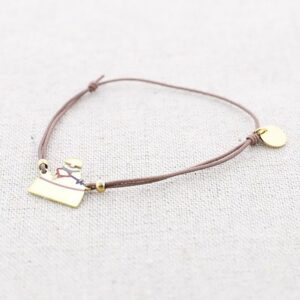 Pulsera elástica con menina acero dorado. Colores vivos, goma taupe