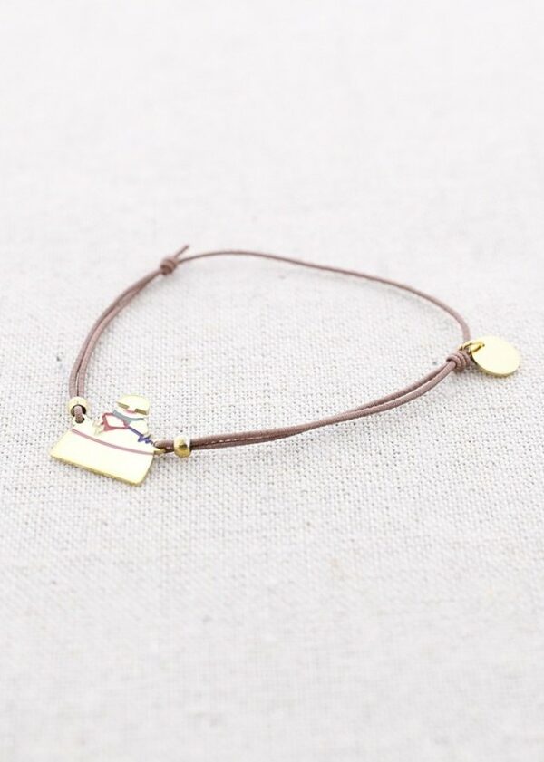 Pulsera elástica con menina acero dorado. Colores vivos, goma taupe