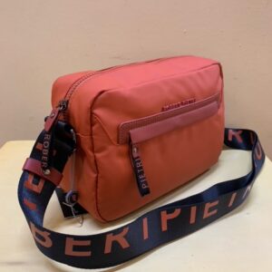 Bolso contenedor tejido técnico naranja Robert pietri. Visto de lado