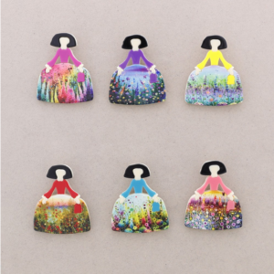 Broche menina falda floral. Diferentes estampados